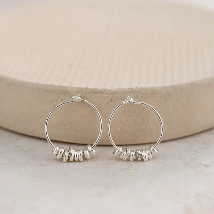 Earth and Elements Jewellery

https://www.earthandelements.co.uk › products › sterling-silver-nugget-hoops