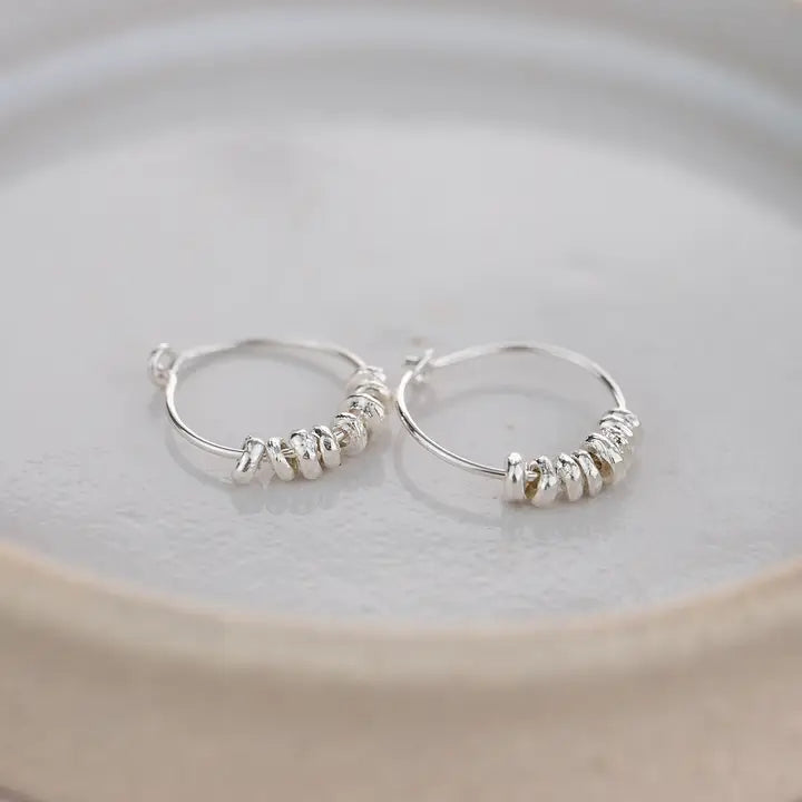 Earth and Elements Jewellery

https://www.earthandelements.co.uk › products › sterling-silver-nugget-hoops