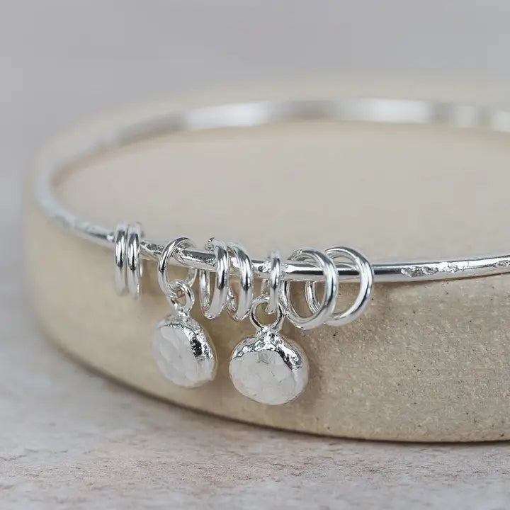 Earth and Elements Jewellery

https://www.earthandelements.co.uk › products › sterling-silver-nugget-bangle