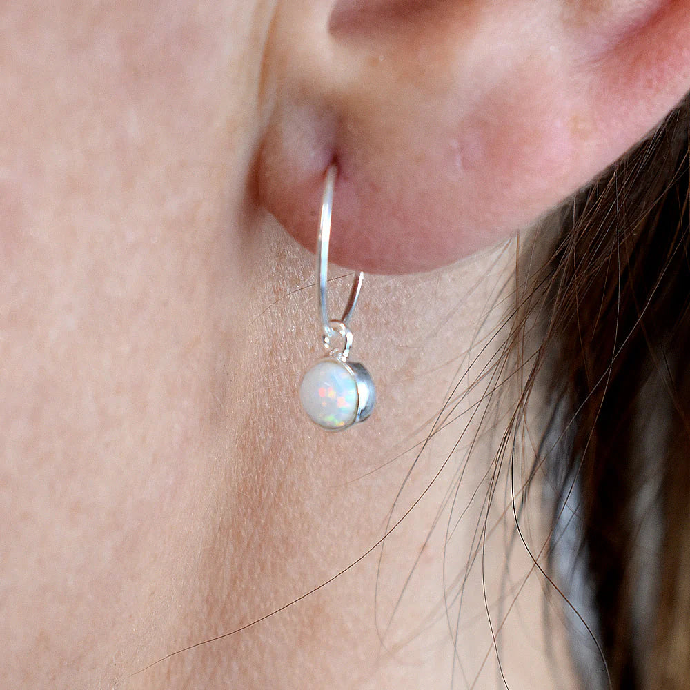 Earth and Elements Jewellery

https://www.earthandelements.co.uk › products › mini-blue-opal-silver-hoop-earrings-new