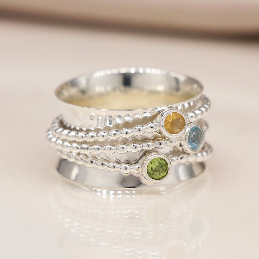 Earth and Elements Jewellery

https://www.earthandelements.co.uk › products › sterling-silver-mixed-gemstone-peridot-topaz-and-citrine-spinning-ring